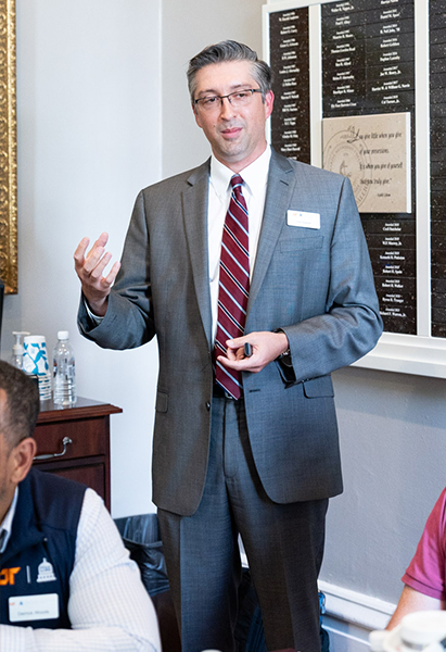 Center for Local Planning Executive Director Josh Suddath speaks to a group in a small room.